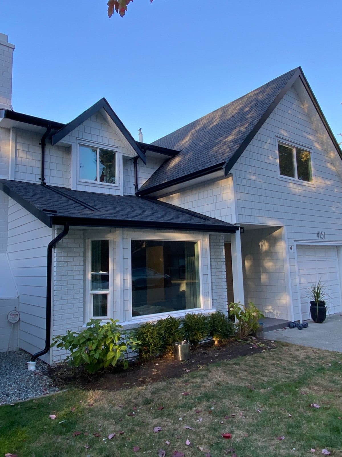 Completed IKO Dynasty charcoal shingle replacement and new gutters
