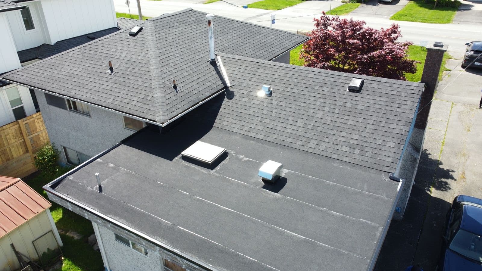 Flat and shingle combination roof