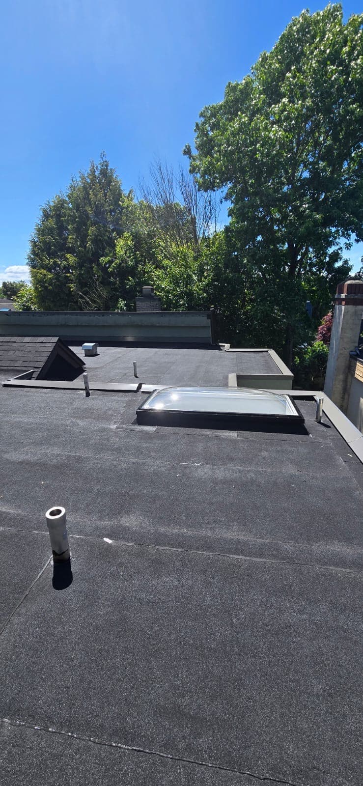 New 2-ply flat roof system and dome skylight