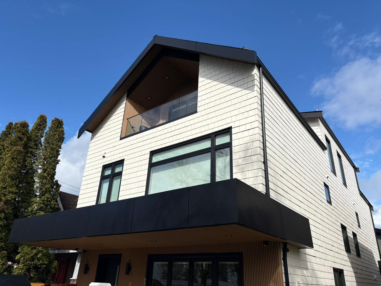 Home exterior, siding and skylight work completed by Dignity Roofing & Exteriors